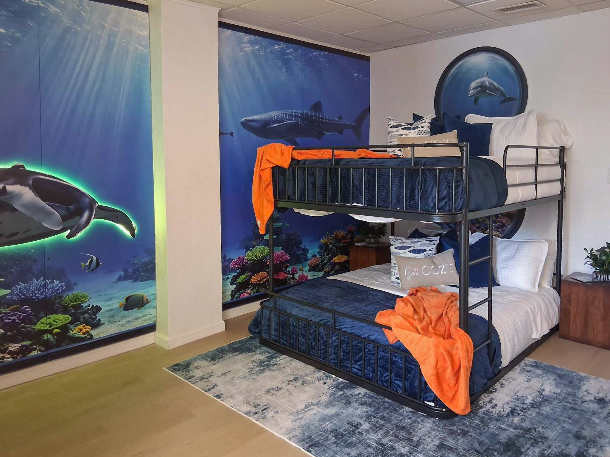 The fourth bedroom is the Aquarium room, including queen bunk beds and twin bunk beds, sleeping up to 6 people comfortably.