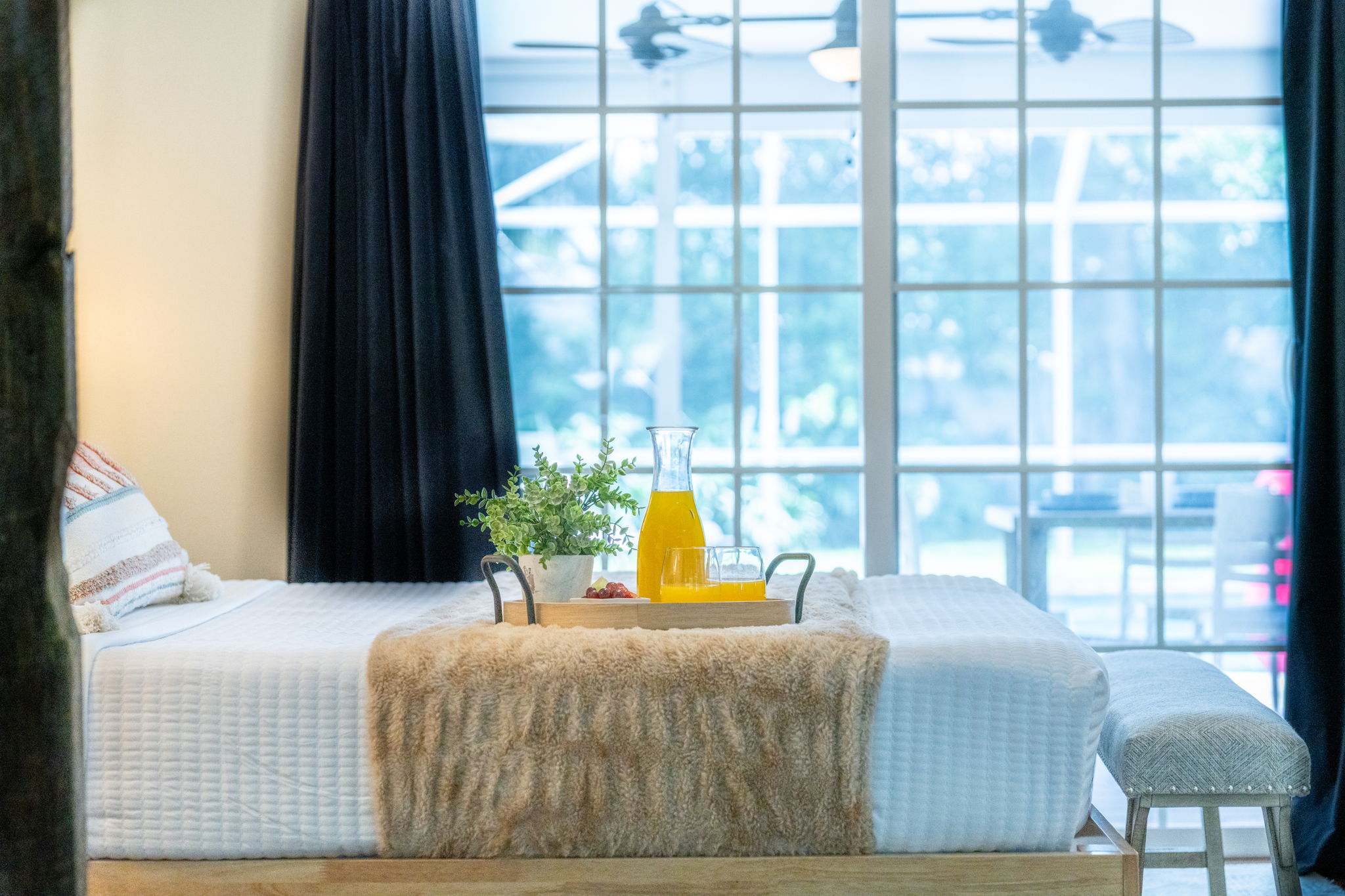 Bright and airy space featuring crisp white bedding and calming coastal décor.
