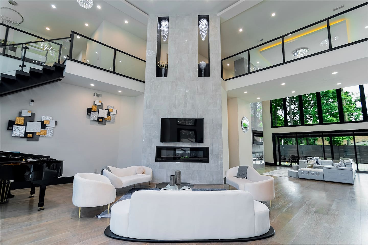 Another inviting living room sits just to the side as you enter the home, offering a warm and welcoming space to relax right from the start.