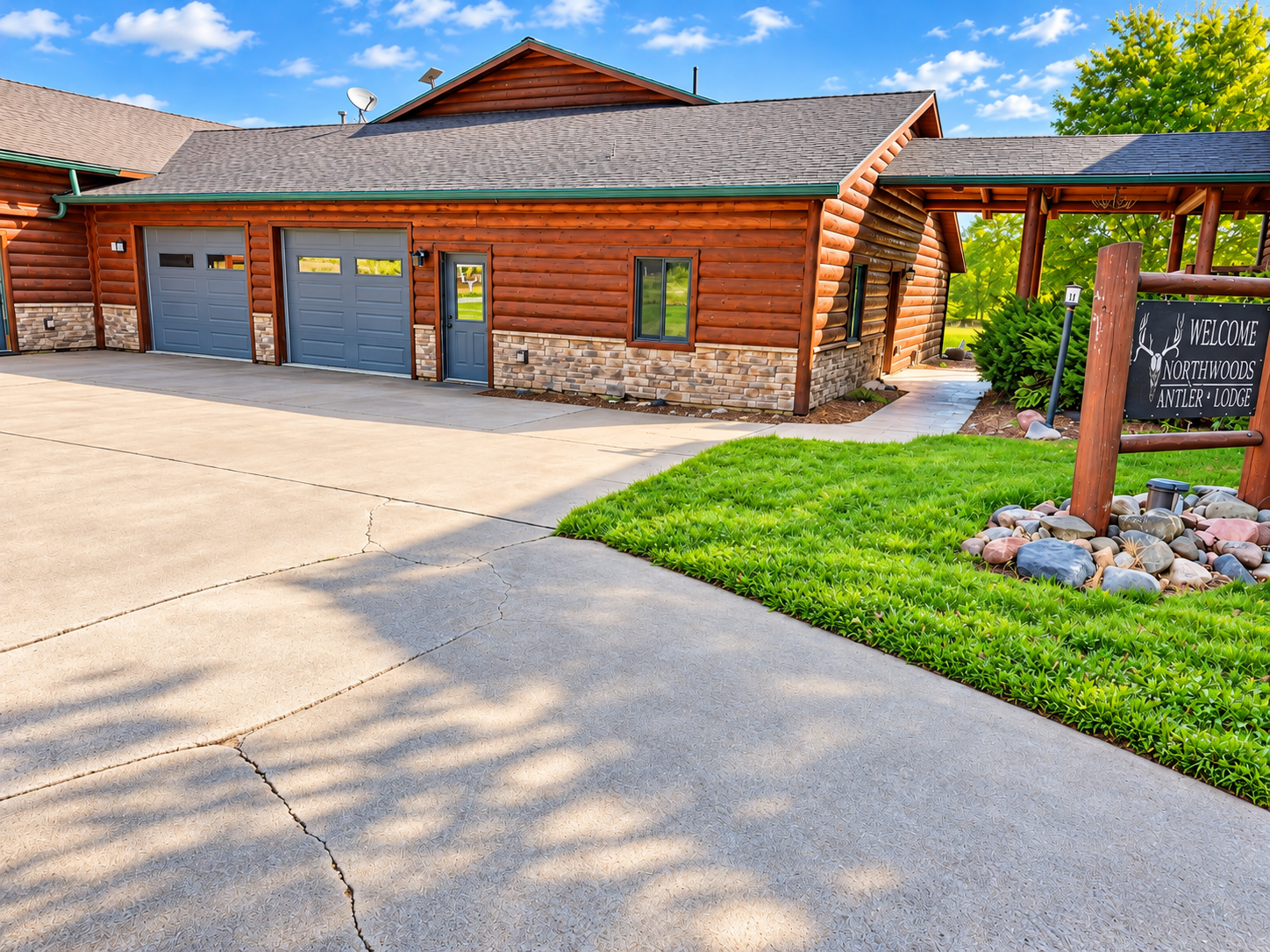 Welcome to Northwoods Antler Lodge, where rustic Northwoods character begins with our handcrafted wooden sign, antler décor, and peaceful landscaped setting in Birchwood, Wisconsin.