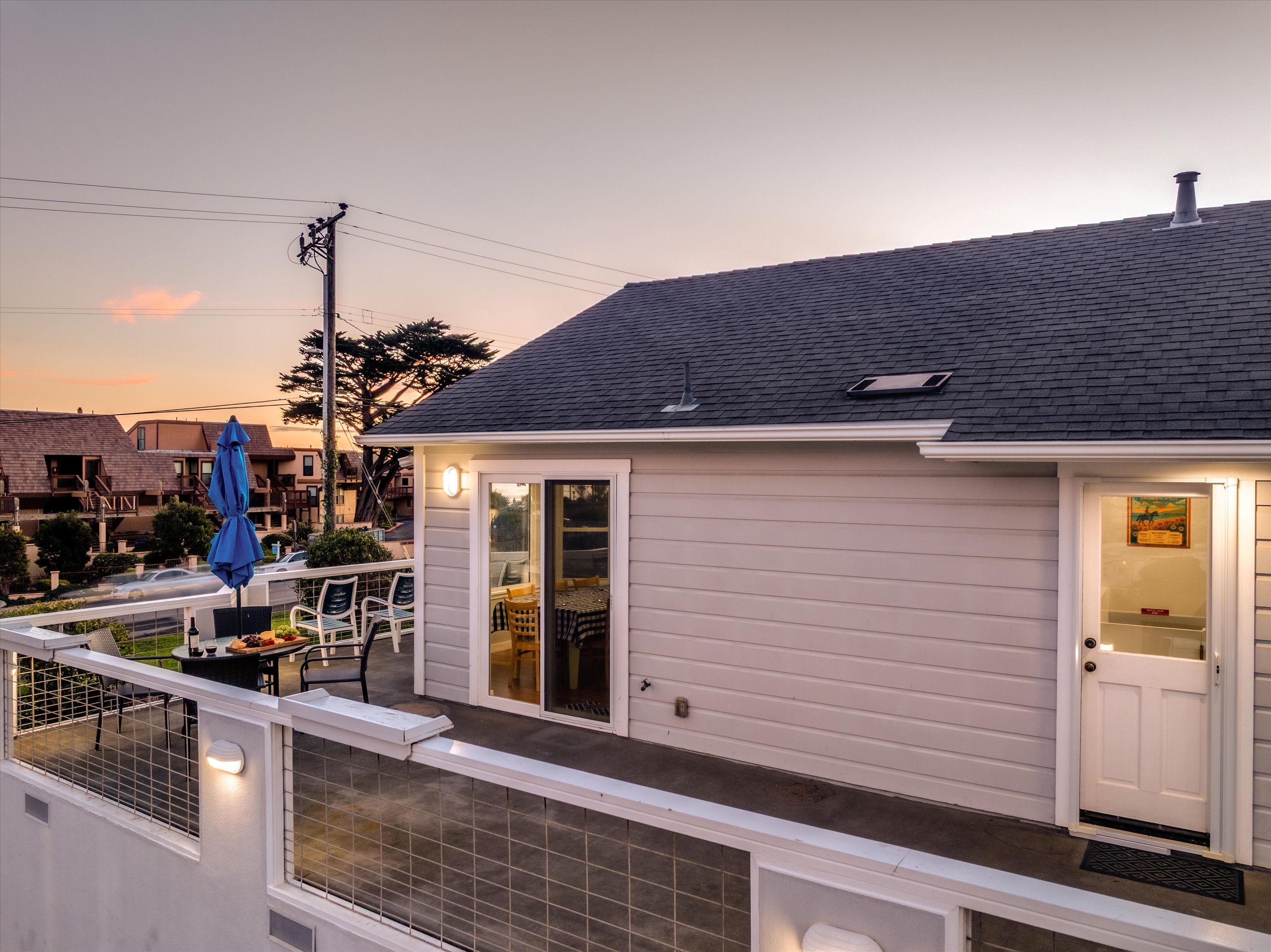 View of the spacious deck with plenty of chairs and dining table