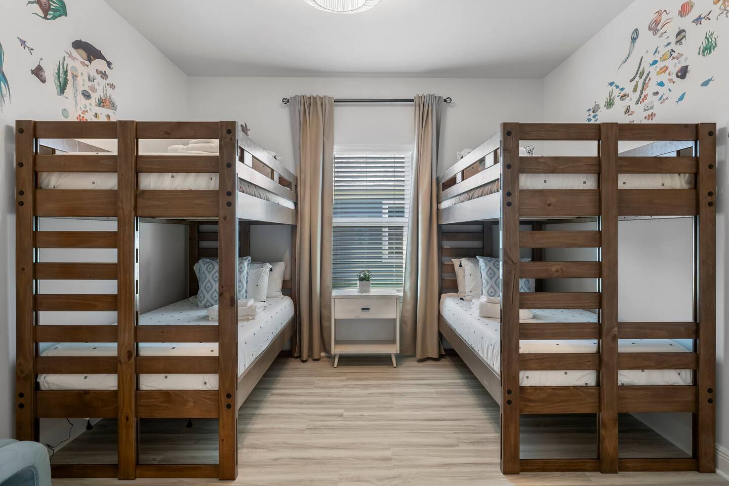 A cheerful retreat with bunk beds, arcade fun, and light-filled windows.