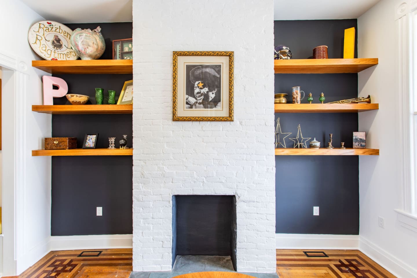 The dining area is beautifully decorated with tasteful accents, such as a chic centerpiece, decorative lighting, and framed artwork, adding warmth and personality to the space.