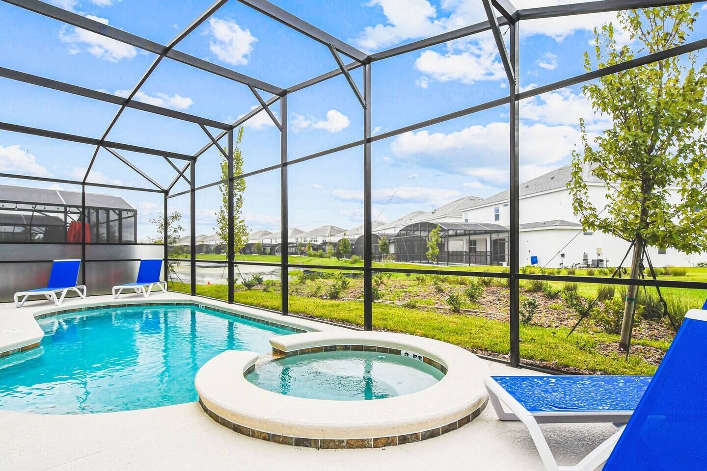 Relax and unwind by the sparkling pool and hot tub, the perfect oasis for a refreshing dip or a soothing soak