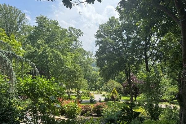 Sky view of Stone Leaf Farm with beautiful gardens and nature abound.