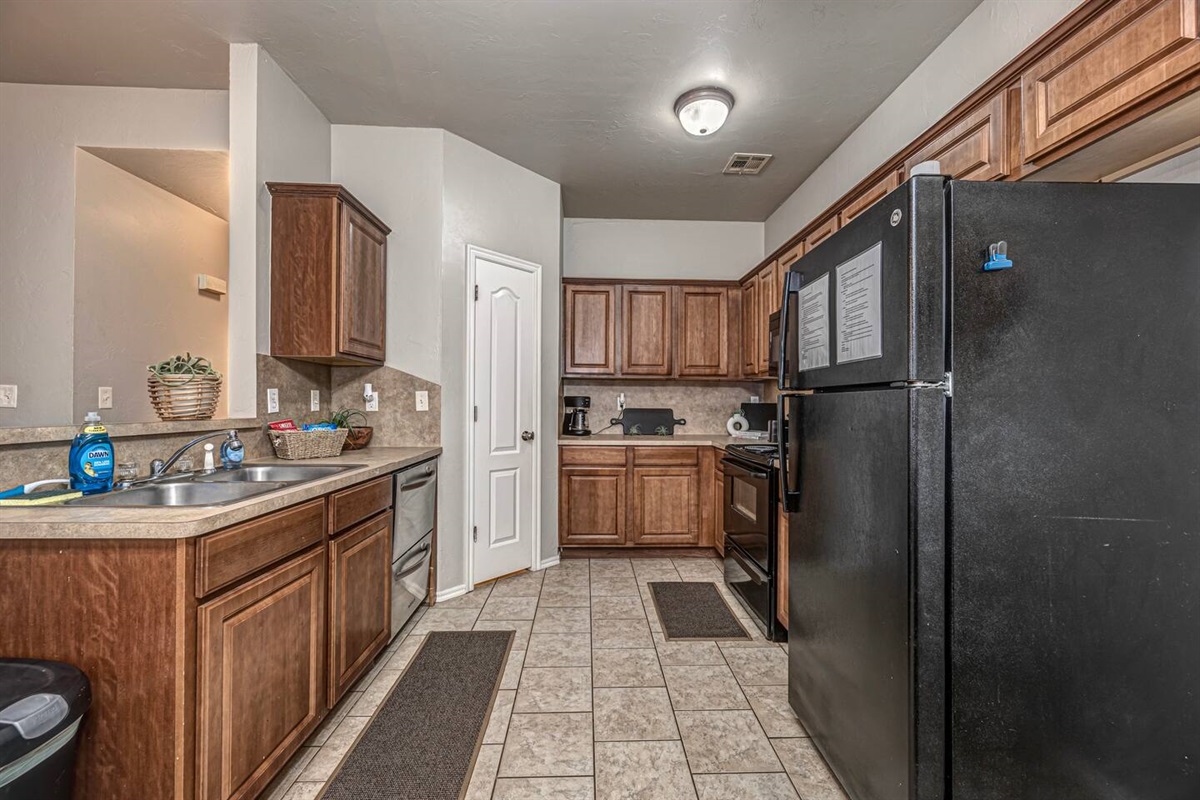 Spacious kitchen with seating for four—perfect for meals or game nights.