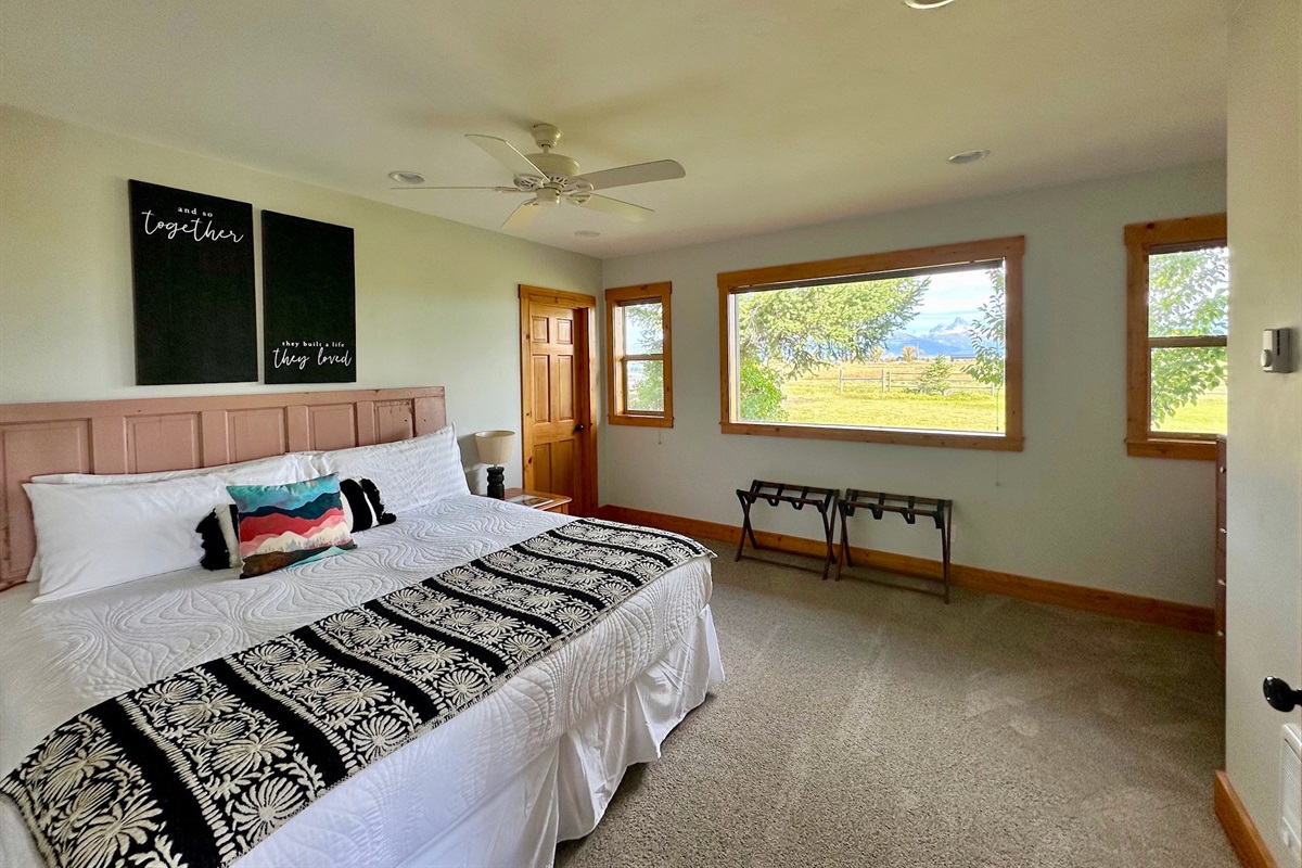 Unit A - Bedroom #2 with a King bed and tasteful decor, found in each of the eight bedrooms.