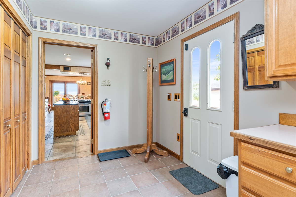 Entry with easy access to the main living areas—welcoming and functional with a corner shower for added convenience 
