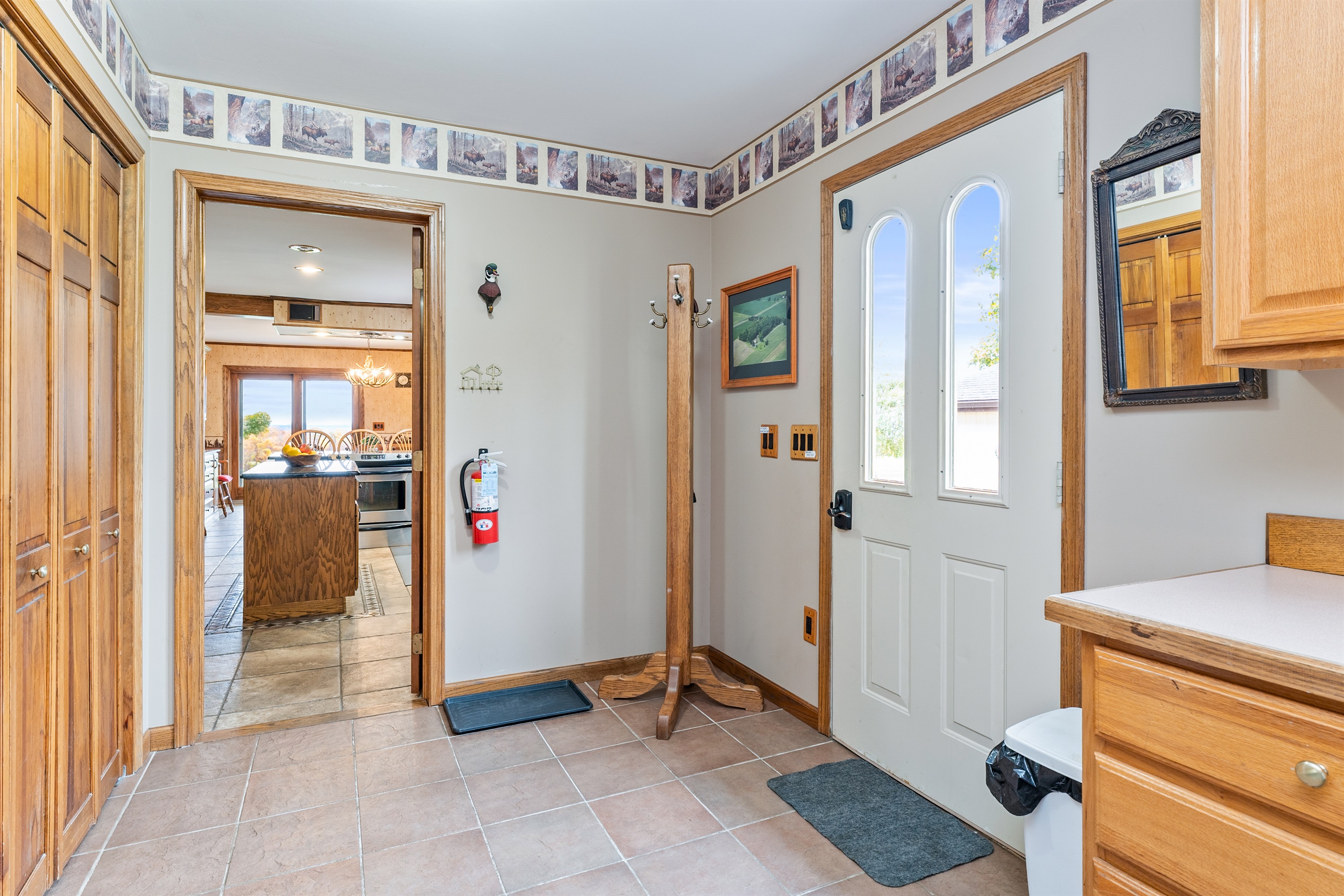 Entry with easy access to the main living areas—welcoming and functional with a corner shower for added convenience 