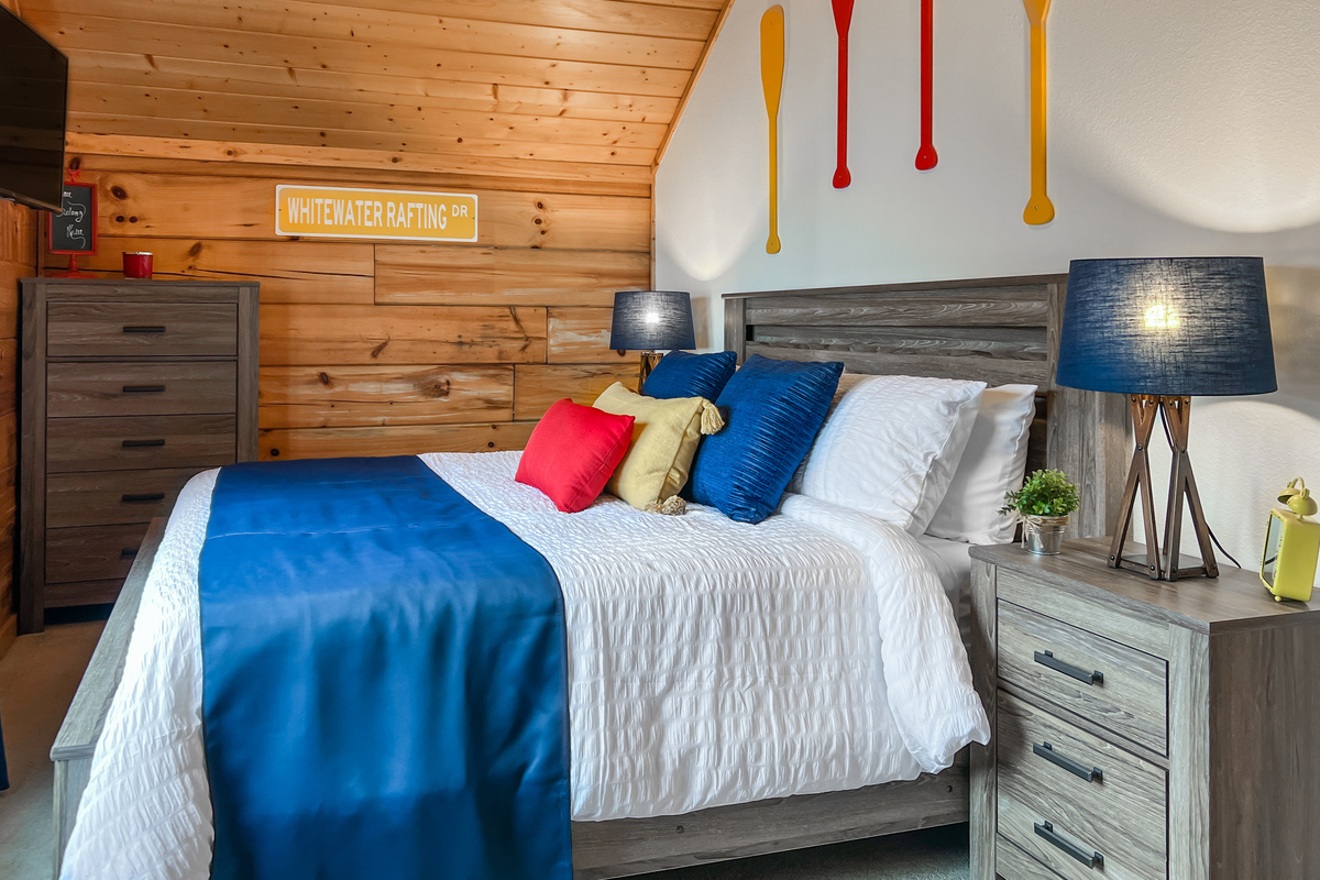 Second-floor Paddle Room with a king bed, mountain-inspired styling and plenty of space to unwind.