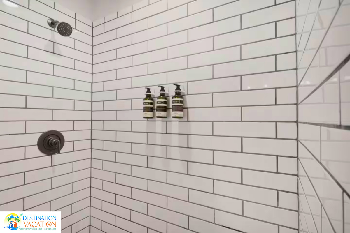 Crisp tilework and elegant details create a spa-like feel.