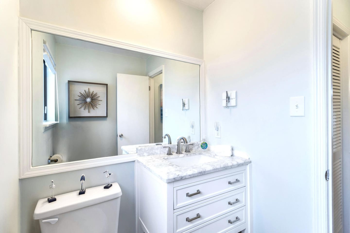 Step into the convenient half bath on the main level &mdash; no need to head upstairs mid-hangout.