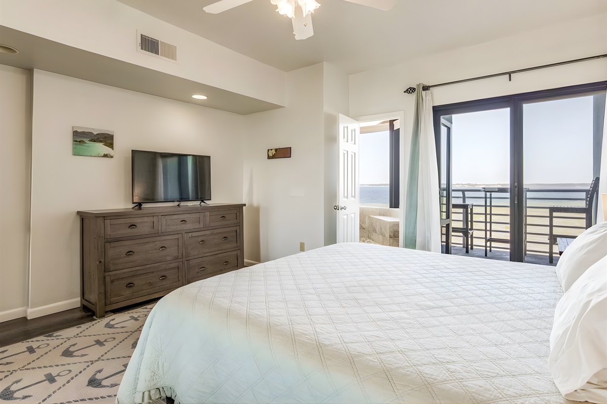 Wake up refreshed in this inviting bedroom with soft tones and plenty of natural light.
