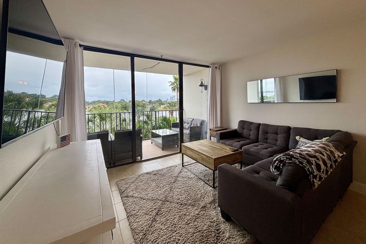 A large TV and comfortable couch is yours to enjoy throughout your stay.