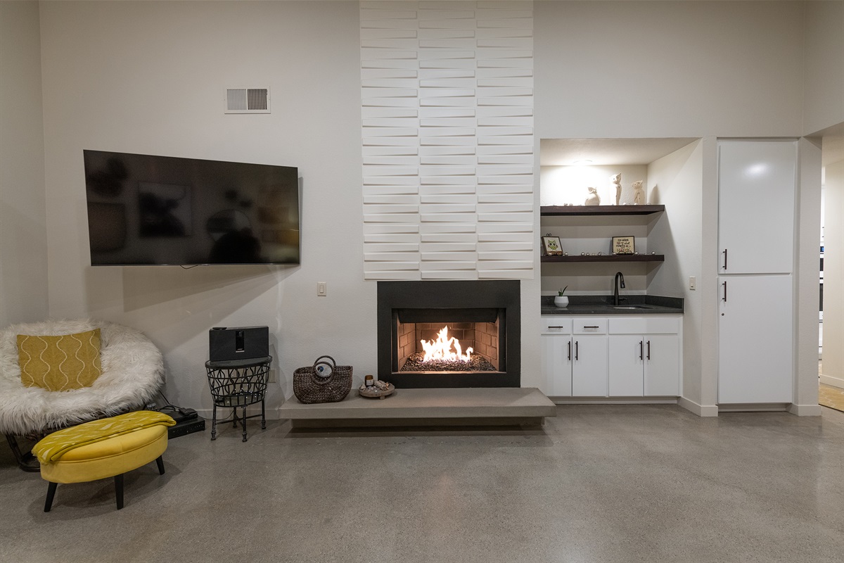 Large TV, fireplace and bar