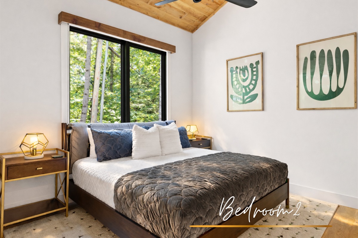 The second bedroom features a king bed and double bed, offering a versatile and welcoming space for guests.