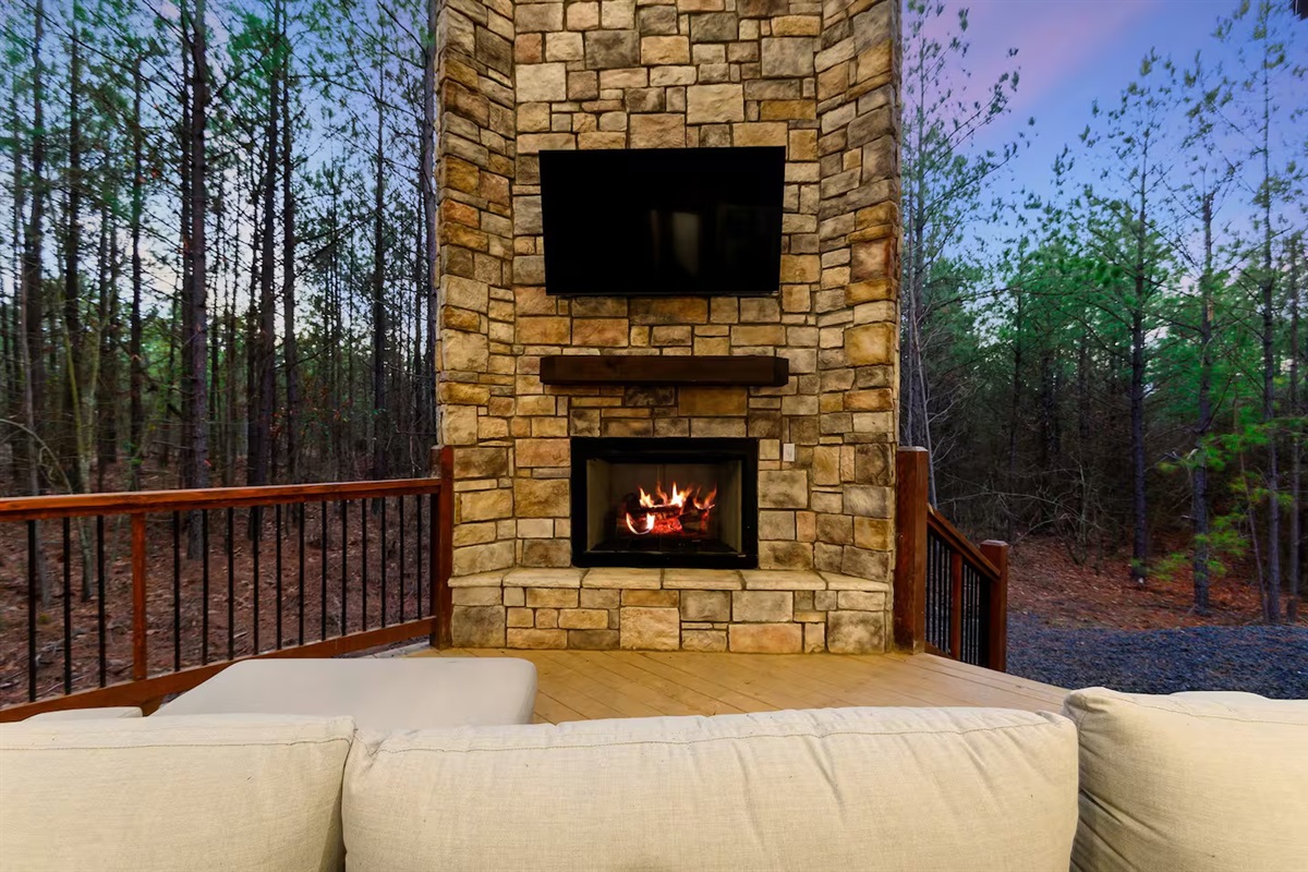 Gather around the glowing fireplace as night falls — laughter, stories, and the scent of pine filling the air.