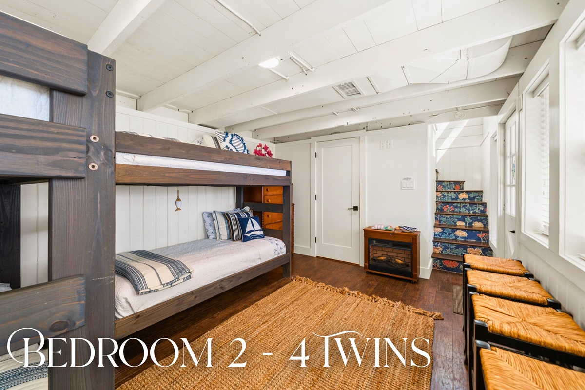 Head into this twin sleeping space where multiple beds provide a practical and welcoming setup, perfect for kids or additional guests.