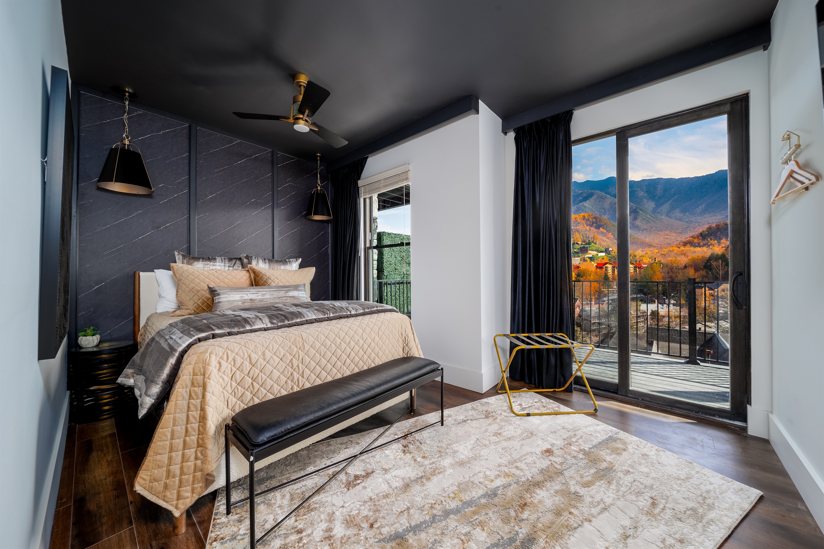 A luxurious Queen bedroom with gorgeous mountain view, designed for ultimate relaxation and comfort.