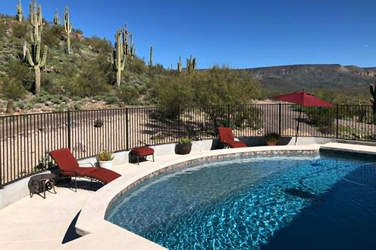Take in the desert scenery from the pool, with lounge seating set up for sunny afternoons outdoors.