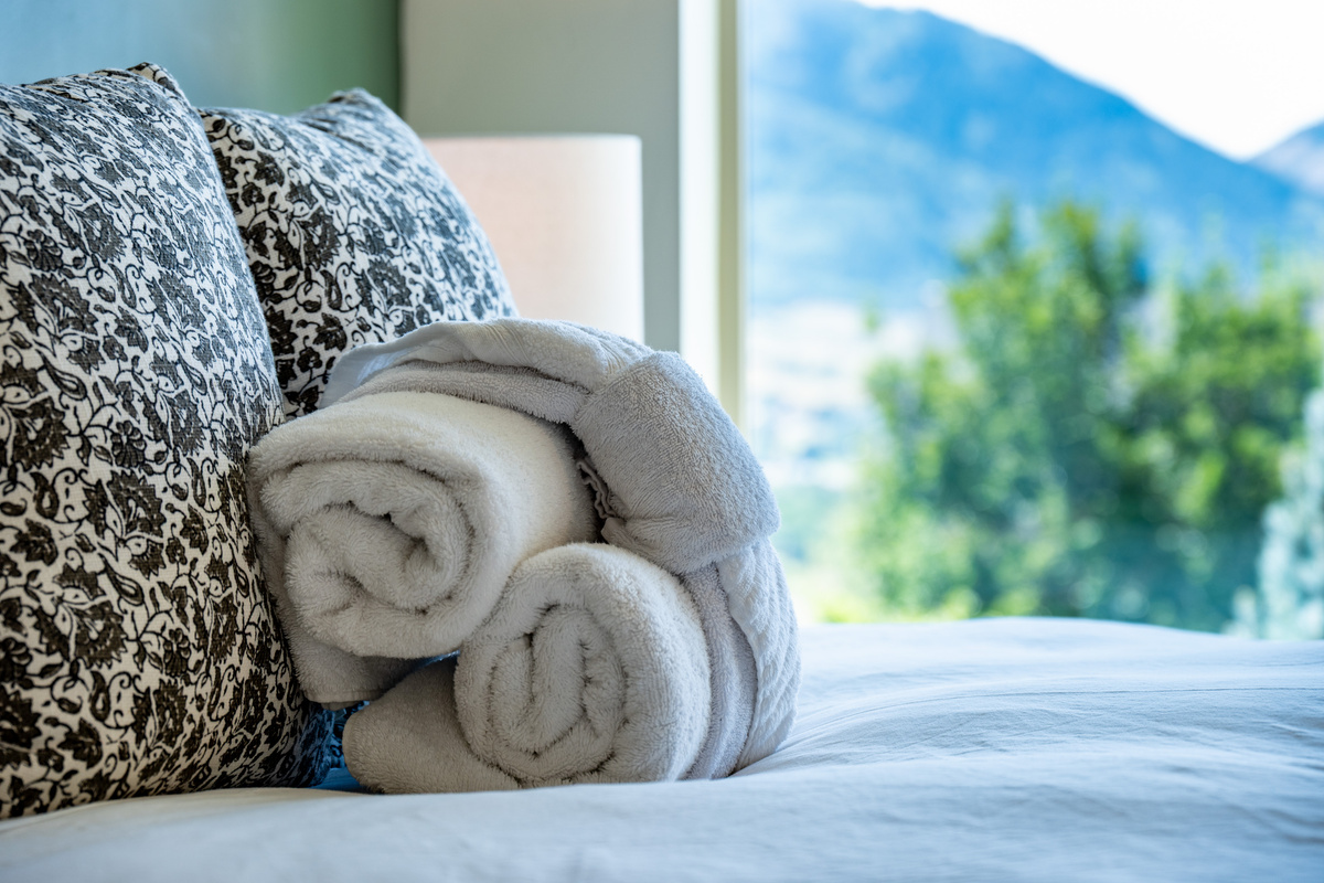 Soft linens and welcoming touches create a restful retreat for overnight guests.