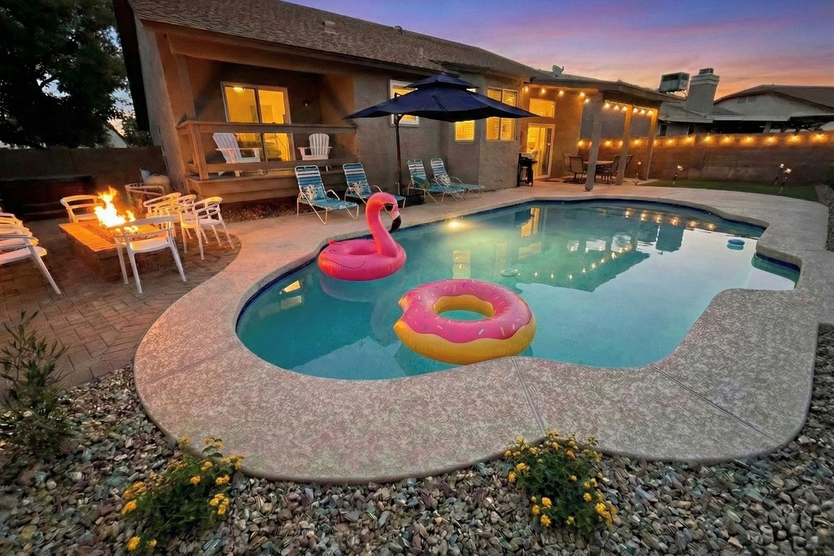 Backyard has a swimming pool (can be heated for additional fee), gas fire pit, hot tub, putting green, sun loungers, dining table for 8, and gas grill.
