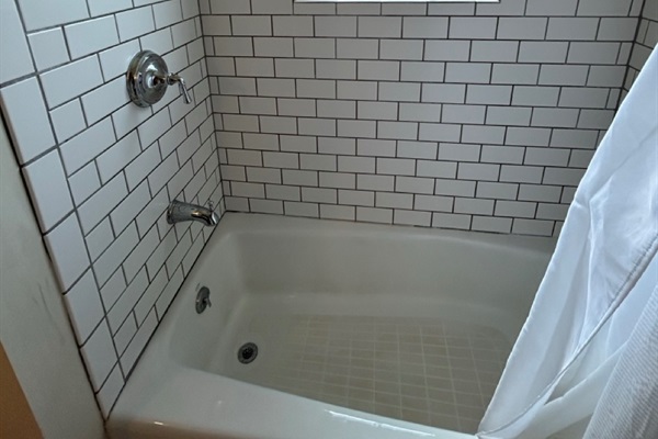 Classic tile and porcelain shower bath.
