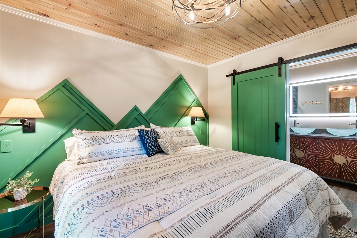 Designer touches at every turn. From the striking green headboard wall to the elegant bedding, luxury awaits your stay.