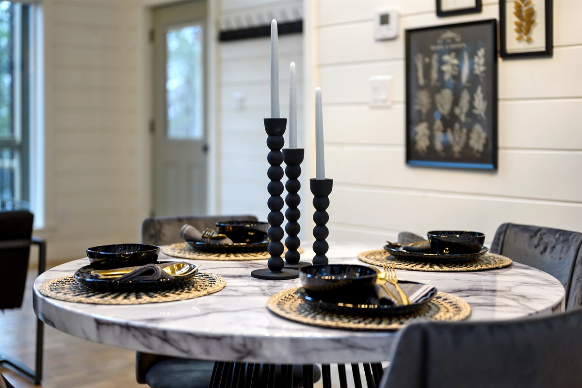 A dining table for four designed for simple, shared meals and easy conversation throughout your stay. ✨