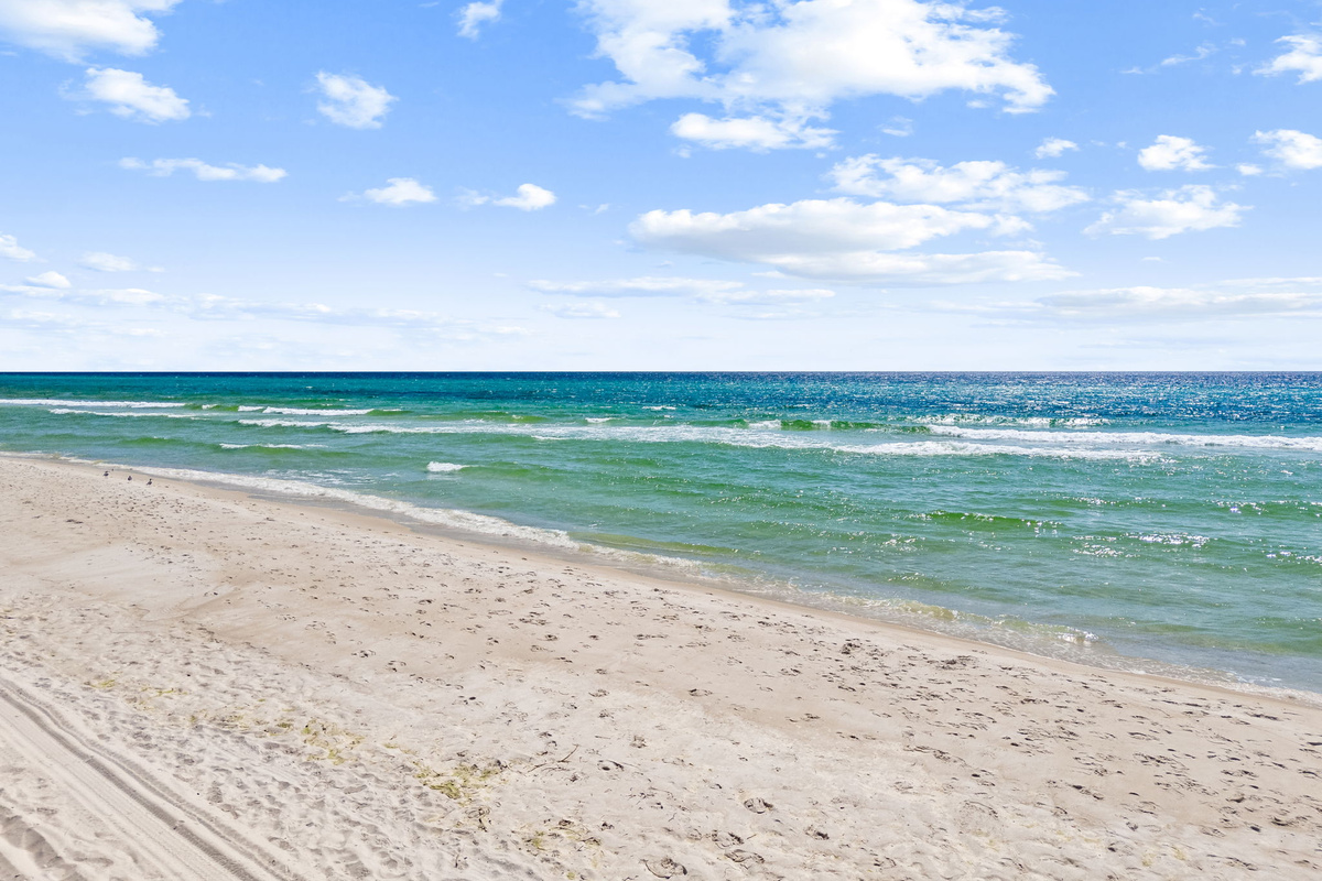 The beautiful white sand beach and blue water are just a short walk or bike ride away.