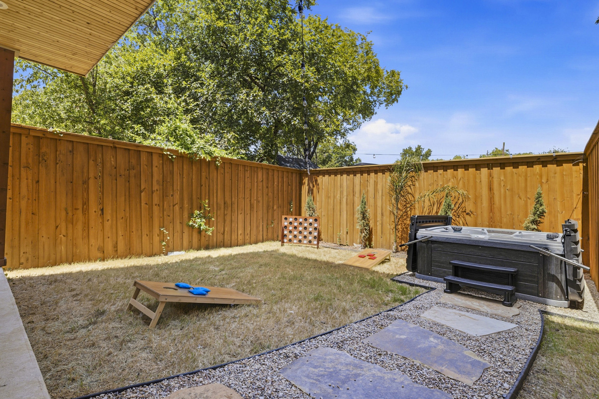 Enjoy outdoor games and a relaxing hot tub in your own fenced relaxation space!