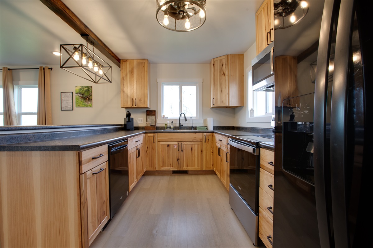 The kitchen includes a dishwasher and many common small kitchen appliances.