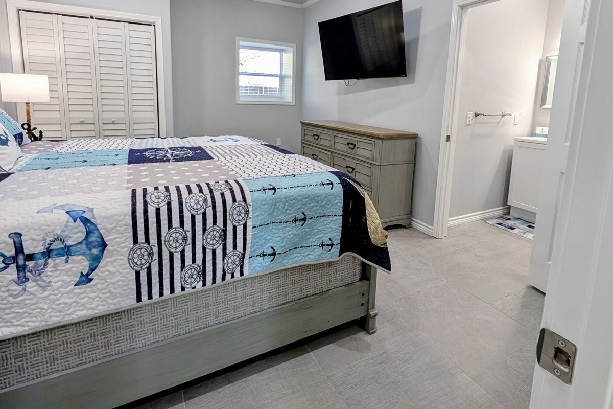 Bedroom two with beautiful coastal decor and smart tv