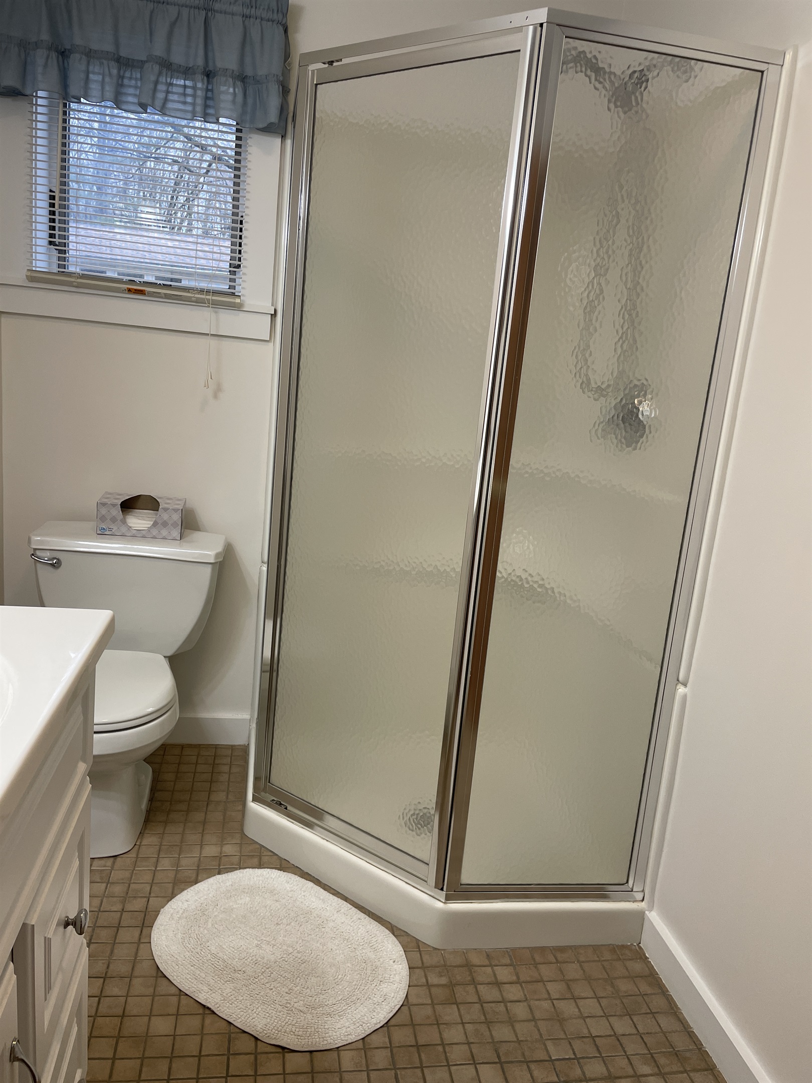 Bathroom with shower off hallway