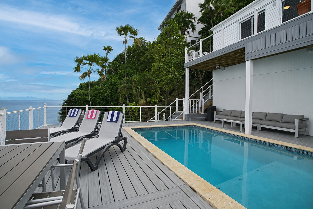 Plenty of sun on the newly expanded pool deck!  But if you want some shade, there are chairs in the covered area behind the pool