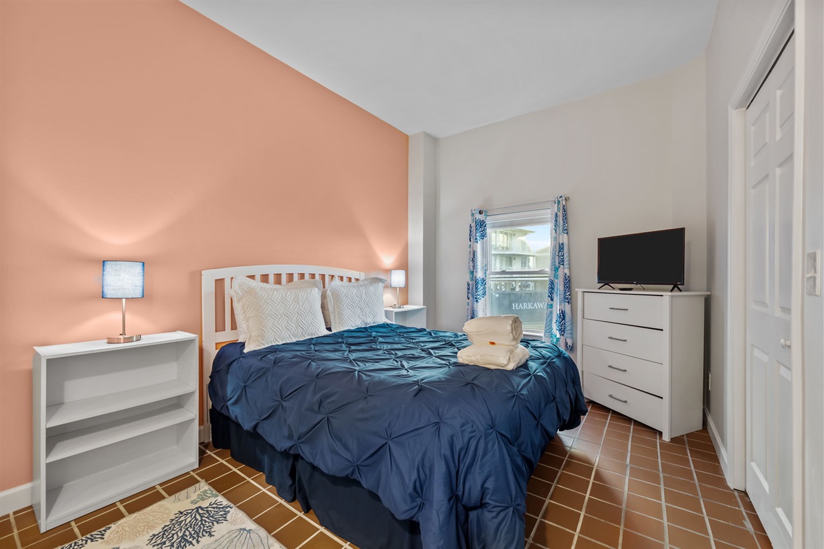 Bright Master bedroom with coastal tones and clean lines