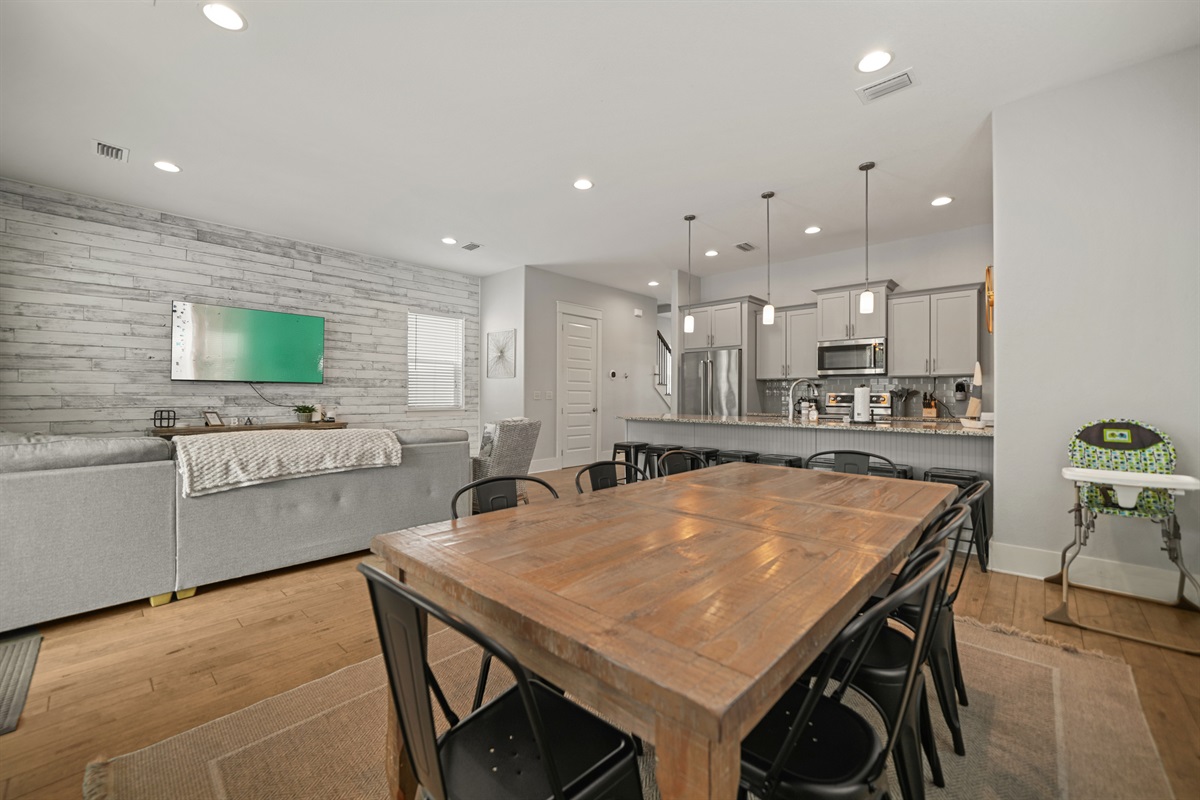 Open-concept dining and living area perfect for gathering and entertaining.