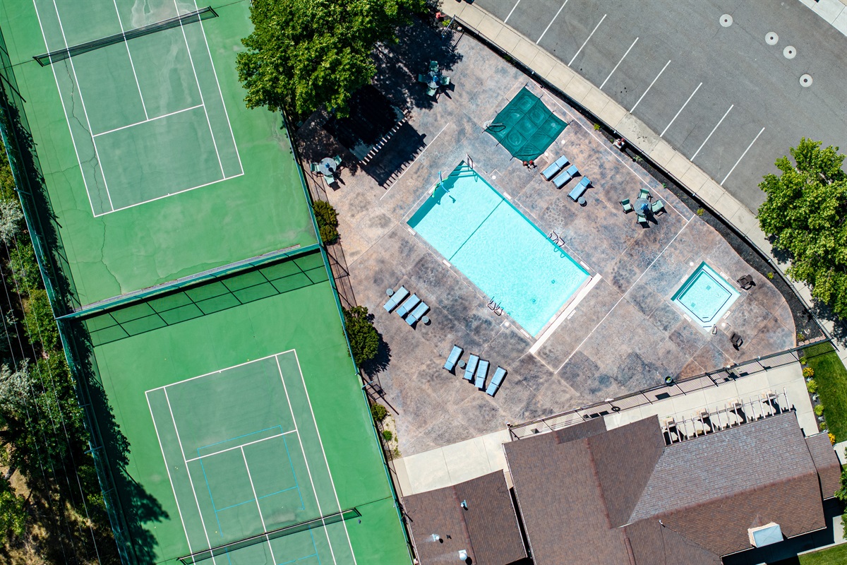 Aerial view of shared pool and tennis courts at Lakeside Village.