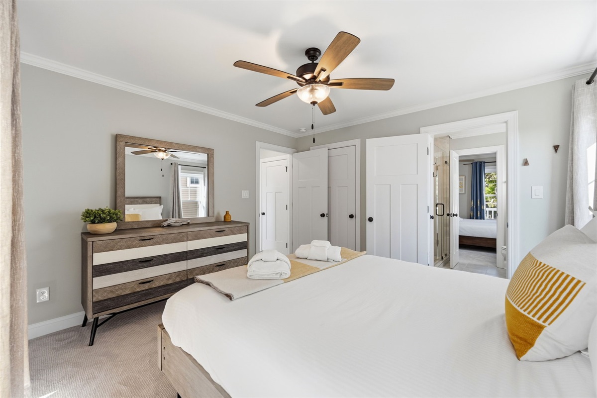 Relax in comfort with plush king bedding, smart TV, and plenty of natural light throughout the room