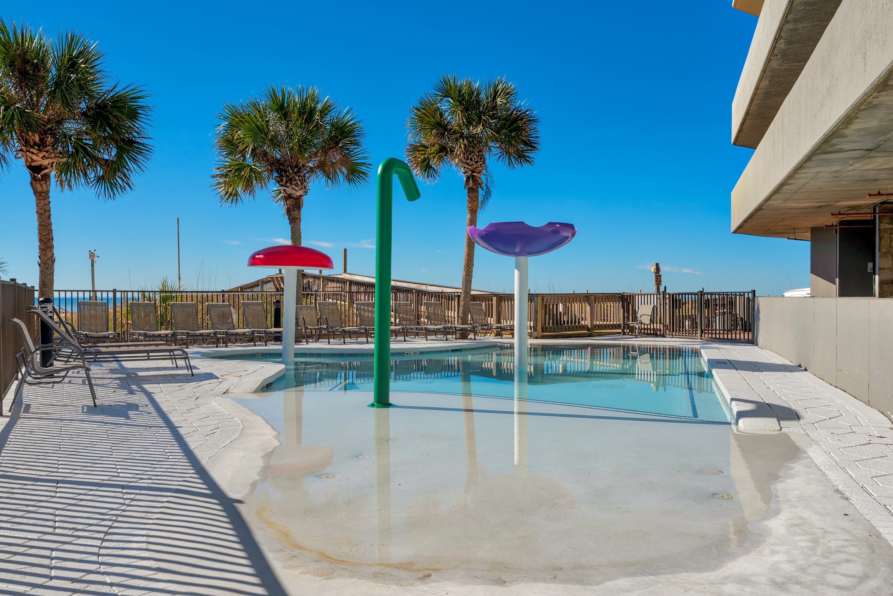 Zero-entry children's splash pool beside the beach.