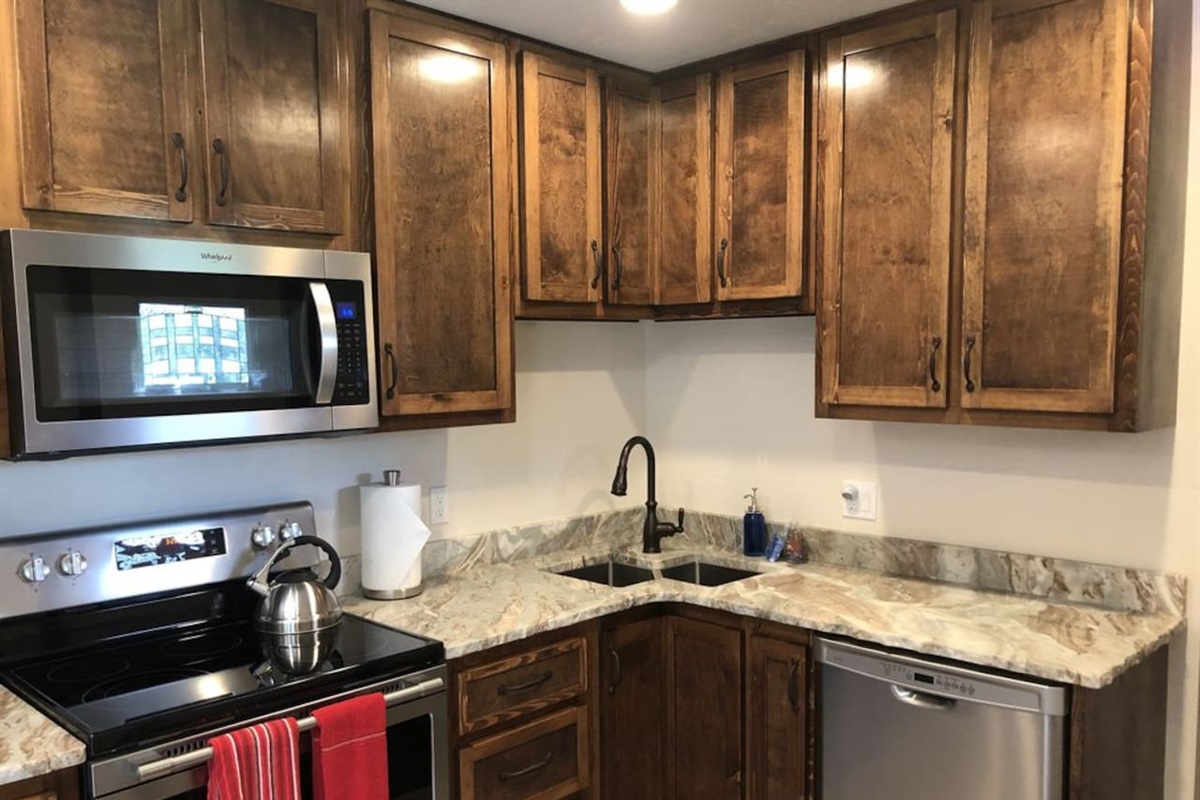 Kitchen sink and dishwasher.