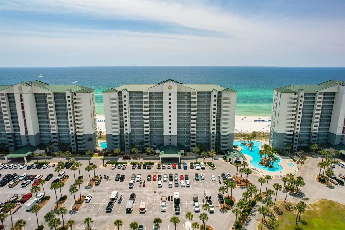 Aerial of the front of the buildings and open parking lot at Long Beach Resort.