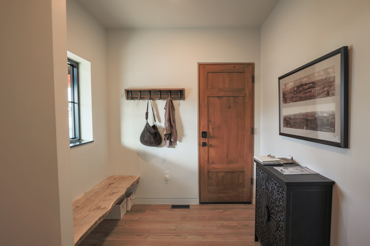 Ample Foyer opposite Laundry Room designed to launch your outdoor adventures.