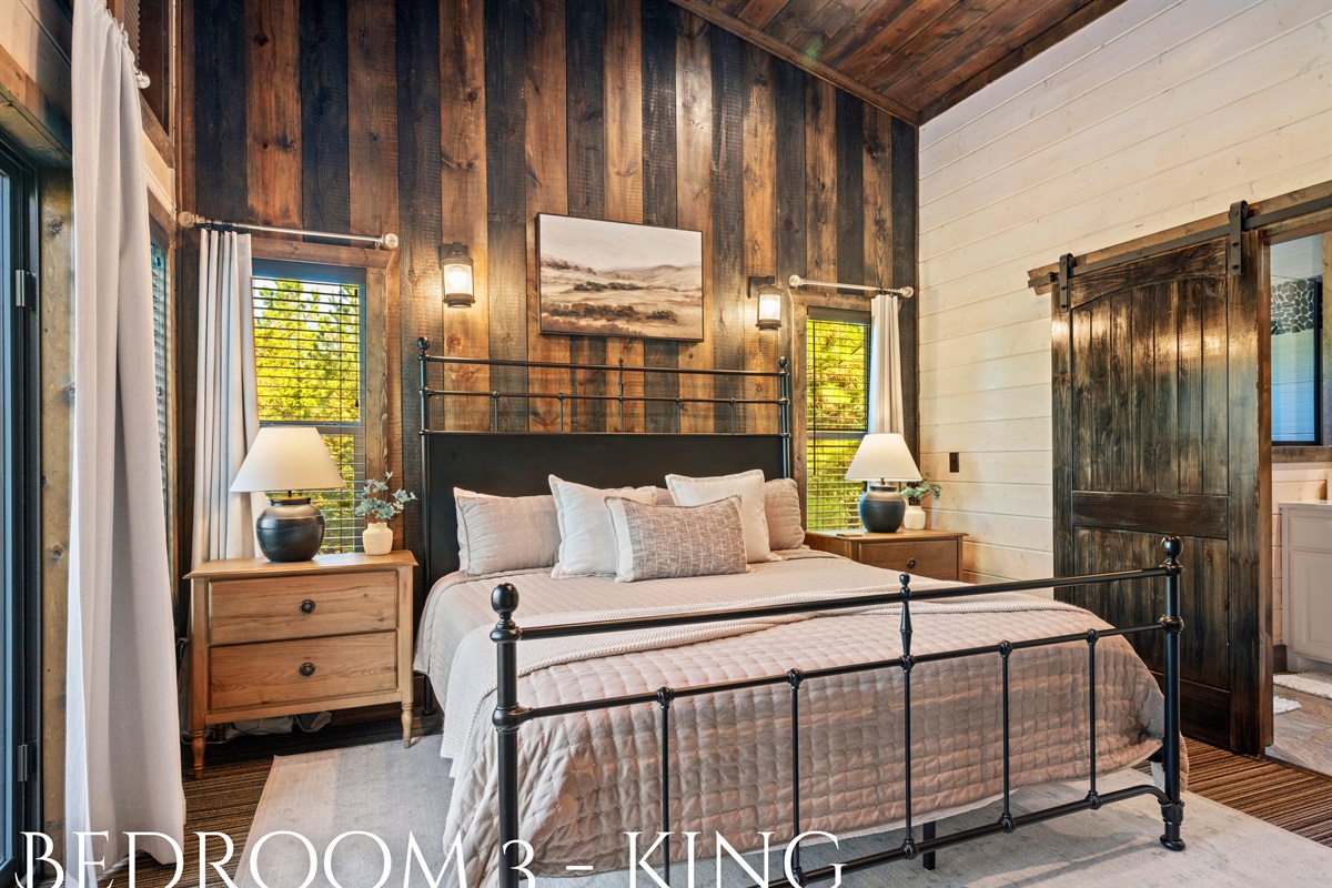 A comfortable king bedroom designed for a restful stay, with modern amenities and rustic touches.