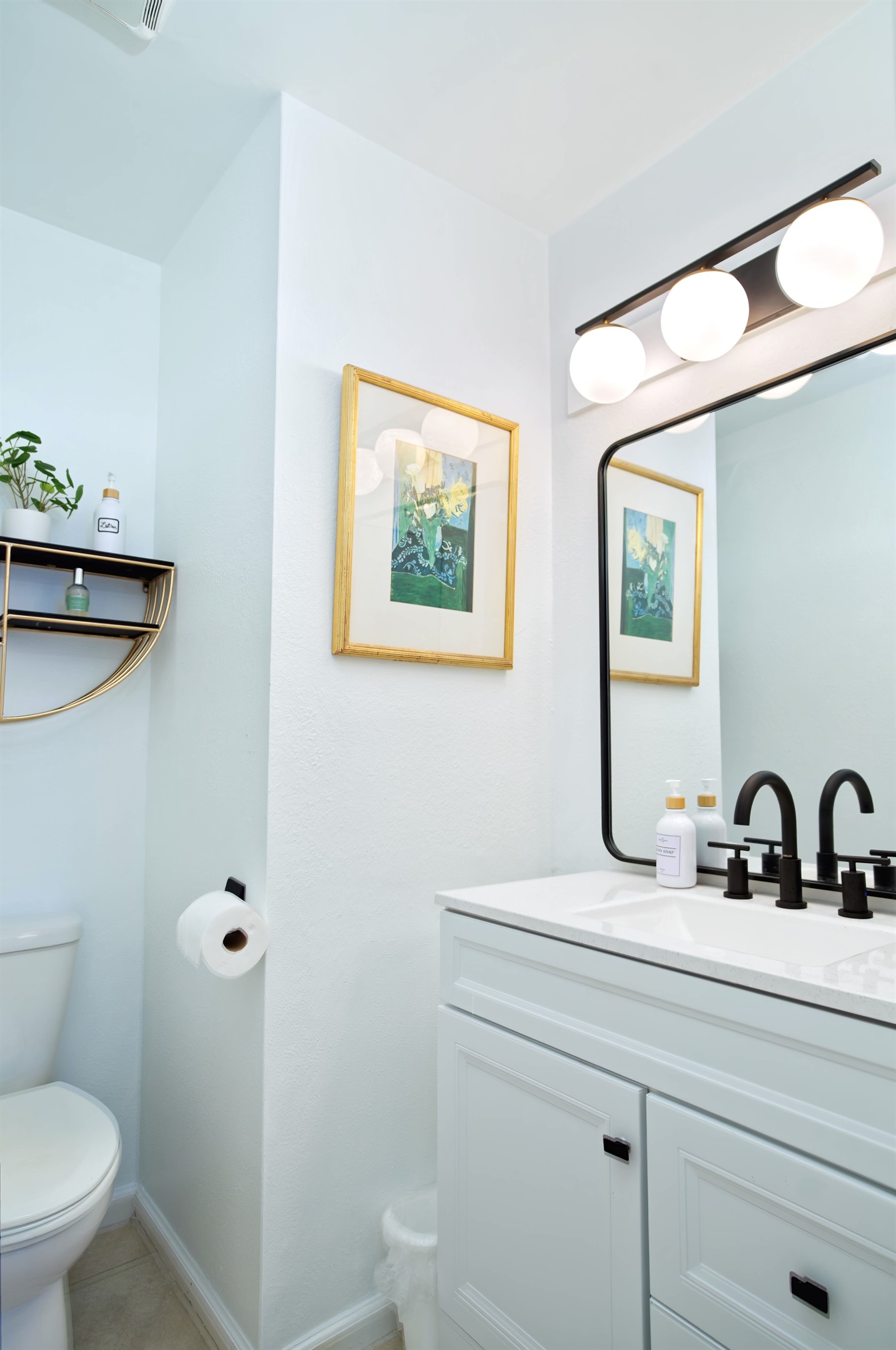 Half bathroom located in lower level next to kitchen