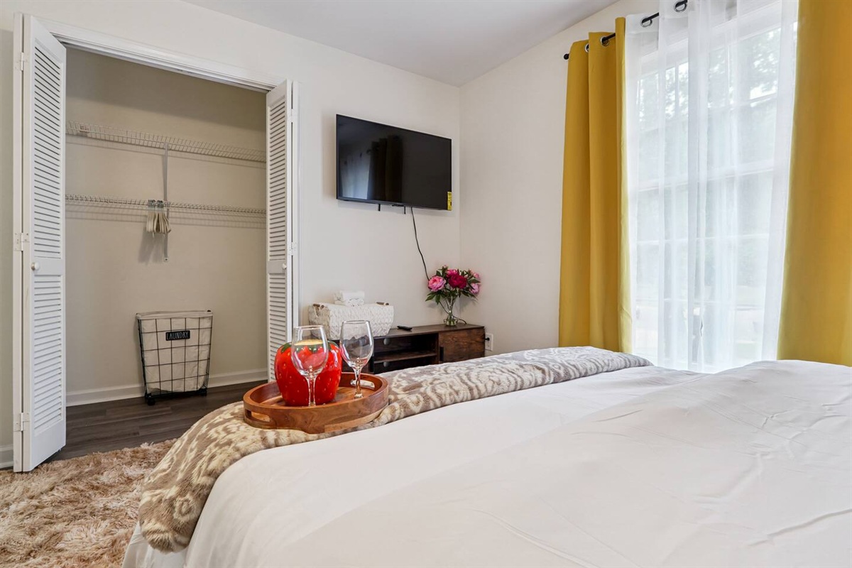 Another cozy bedroom featuring both a full bed and a twin bed, along with an Amazon Fire-powered Smart TV for your entertainment. This room includes 4 full-body towels, 4 washcloths, and 2 hand towels for your stay.