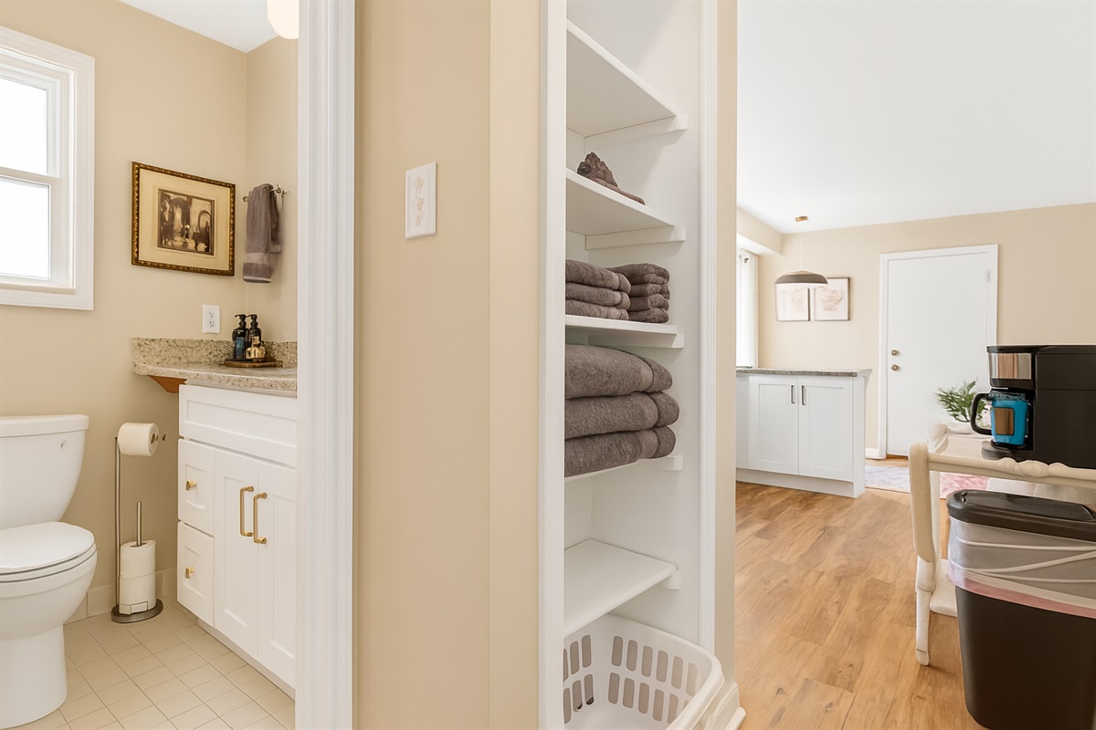 Our bathroom showcases an uncomplicated yet efficient layout, featuring a convenient vanity for your comfort.