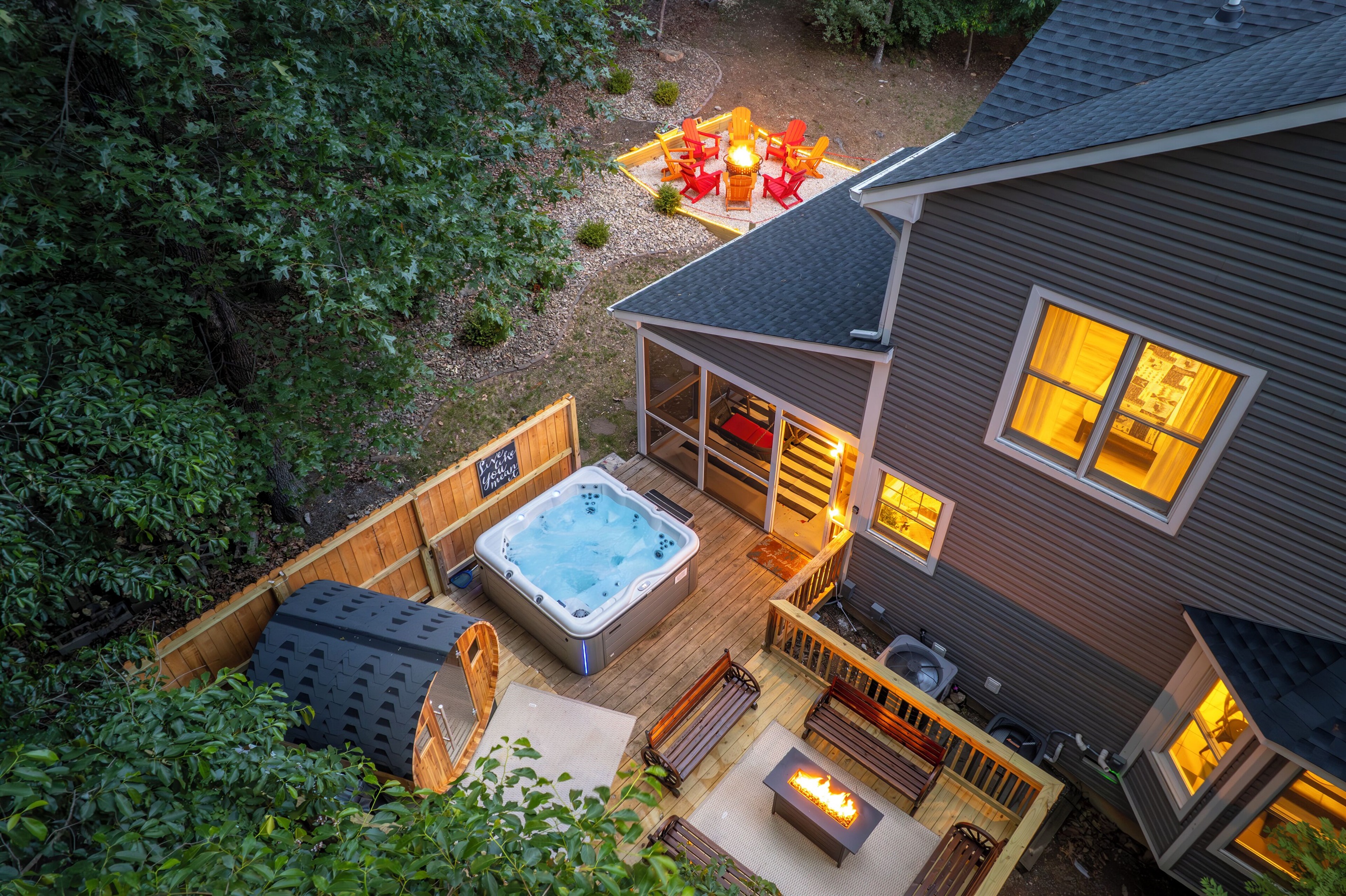 Deck with hot tub, sauna, and propane firetable / seating area
