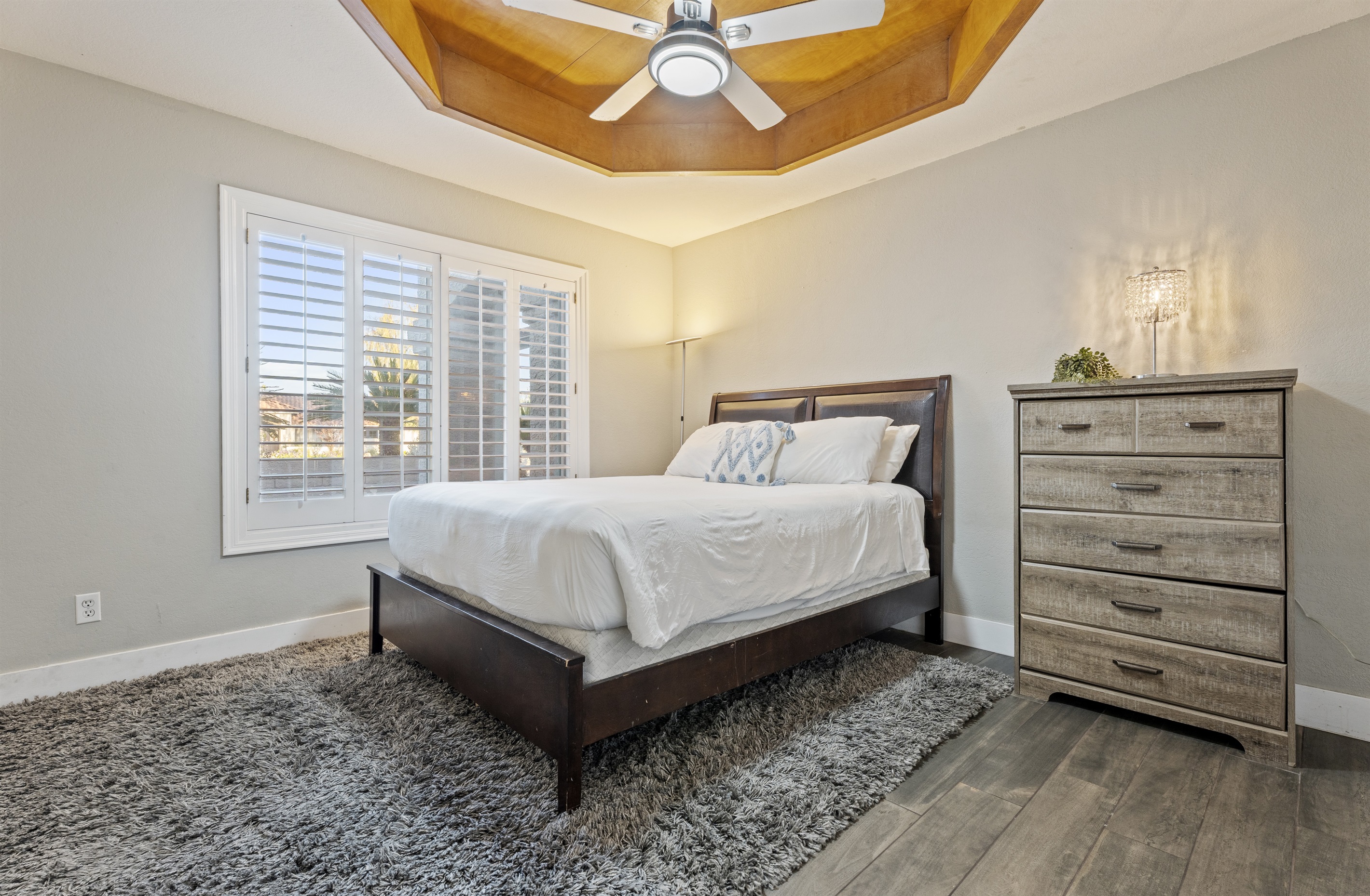 Fresh and functional, the laundry room pairs charming wallpaper with updated appliances and access to the outdoors.