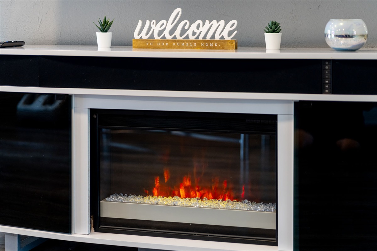 Touches like the “welcome” sign, warm lighting, and inviting decor create a homey, personalized feel amid upscale design.